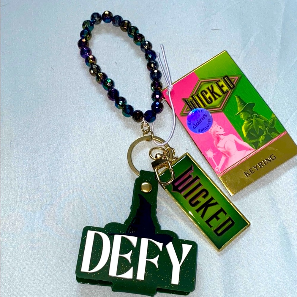WICKED DEFY GRAVITY Green and Black Keyring Bracelet. CLAIRES BRAND NEW